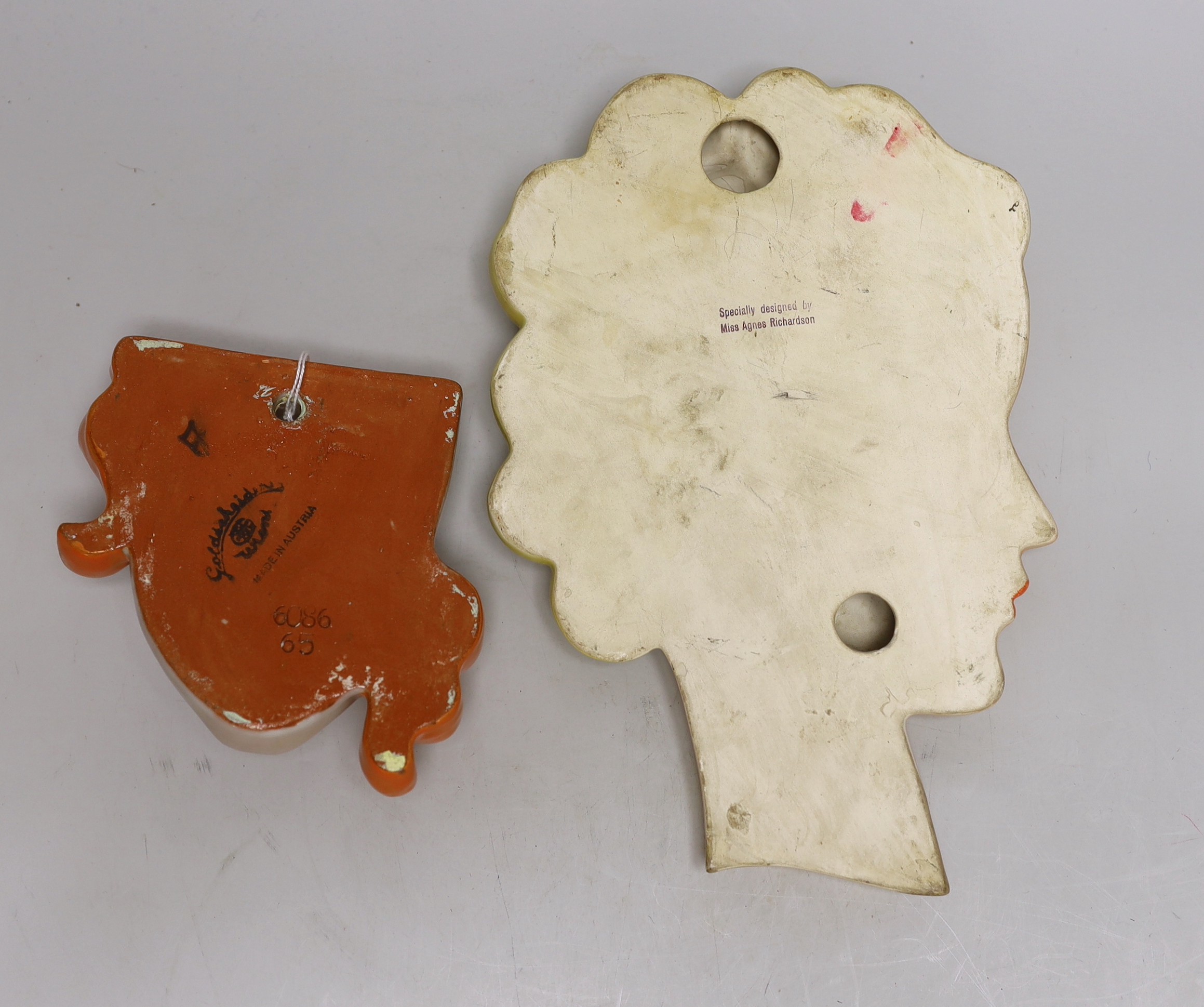 A Goldscheider wall mask and another, designed by Agnes Richardson, largest 29cm